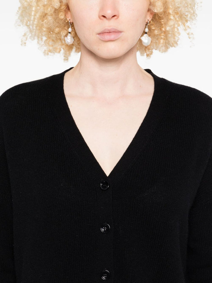 Allude

Black cashmere sweater with V-neck