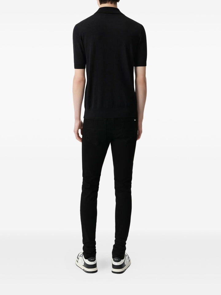AMIRI
Jeans MX1 con strappi