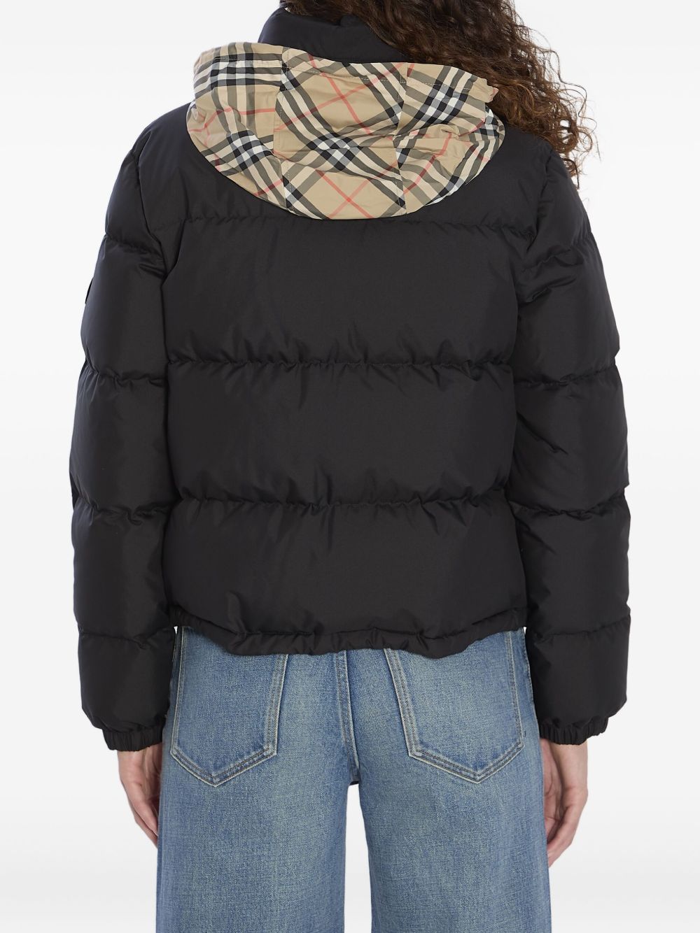 Burberry
Piumino nero con motivo a quadri