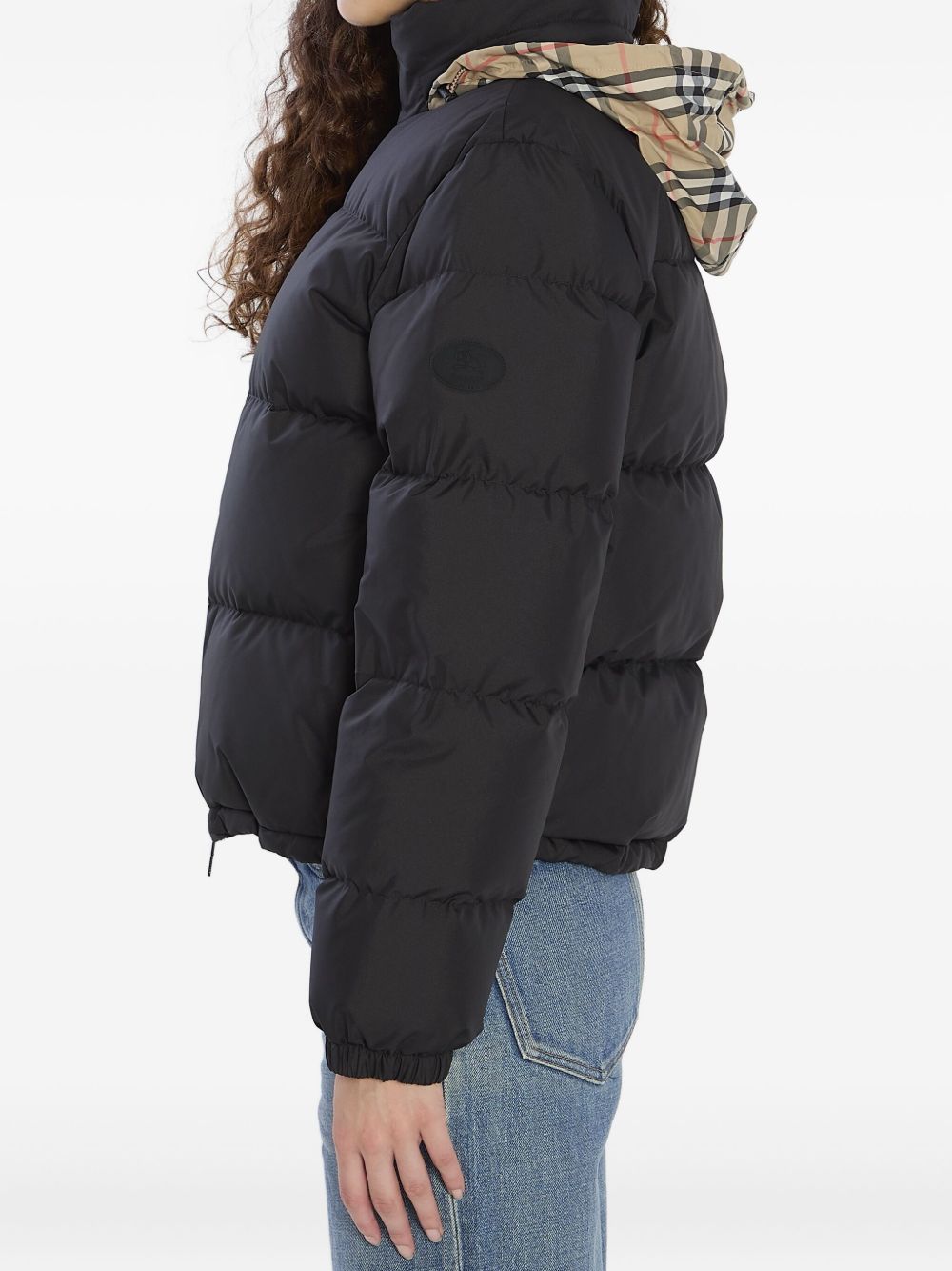 Burberry
Piumino nero con motivo a quadri