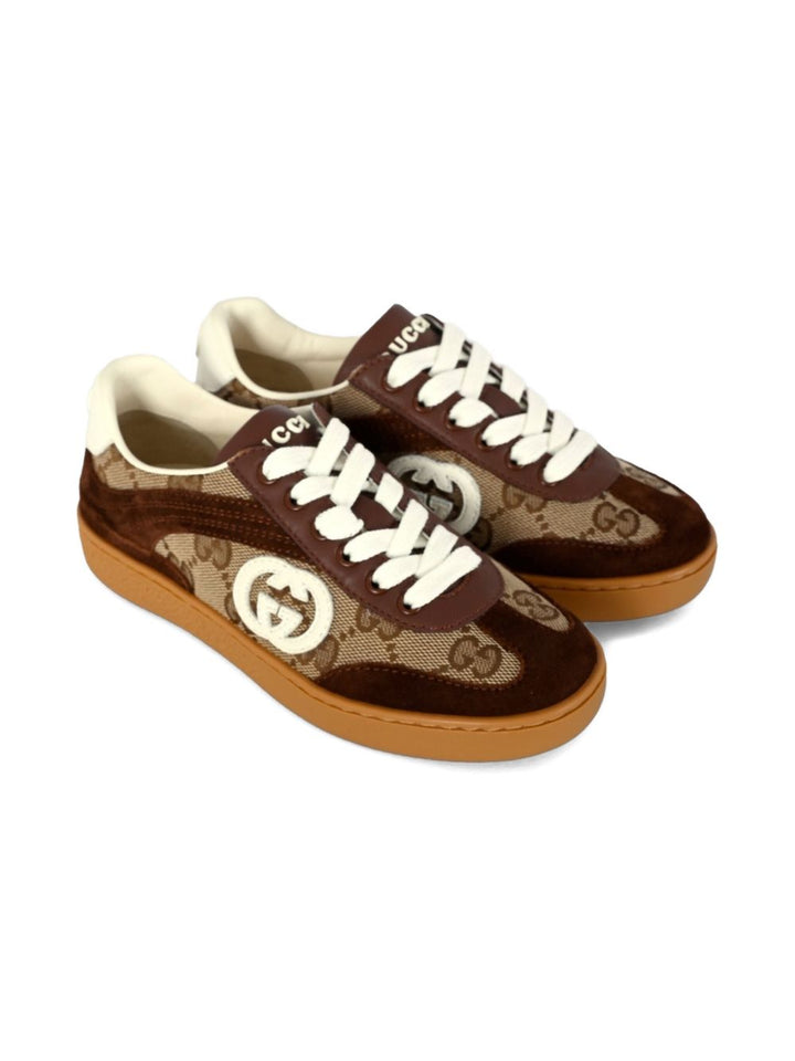 Gucci Kid
Tessuto GG beige e marrone scuro