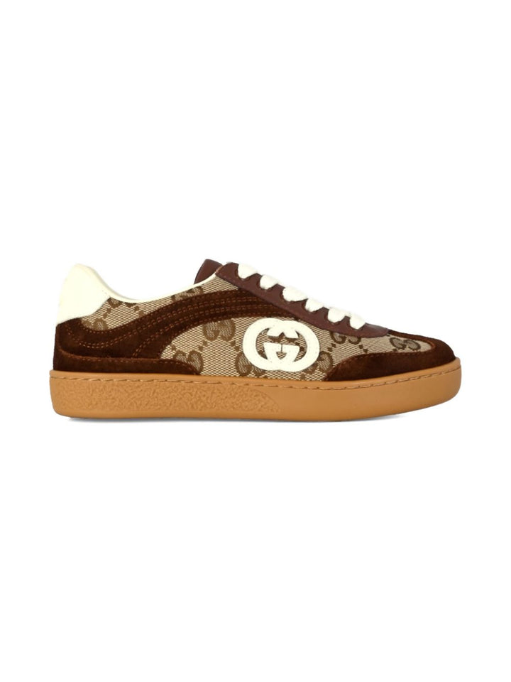 Gucci Kid
Tessuto GG beige e marrone scuro