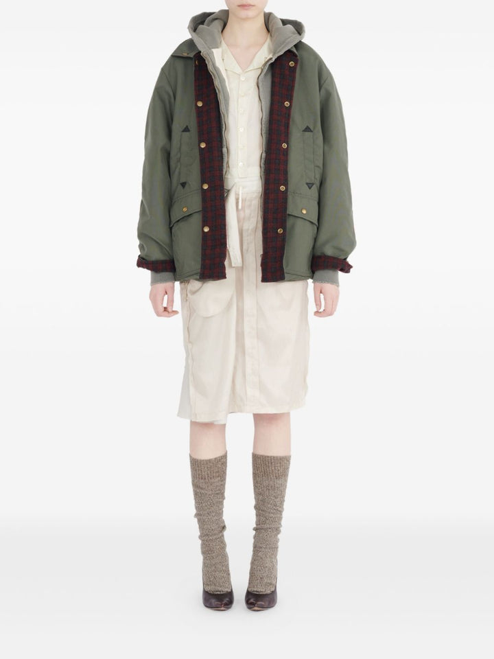 Maison Margiela
Camicia verde oliva, design trapuntato,