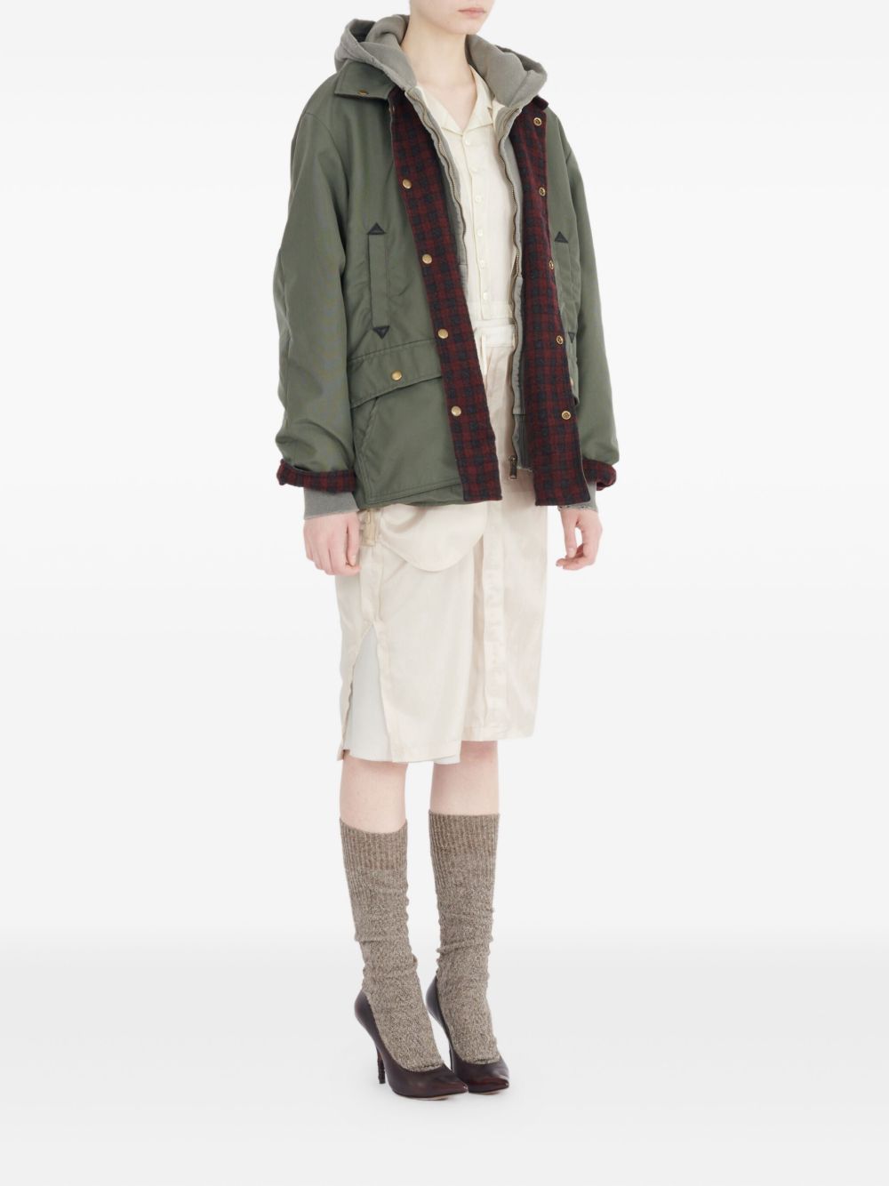 Maison Margiela
Camicia verde oliva, design trapuntato,
