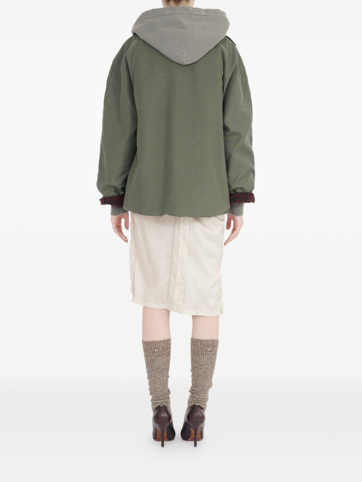 Maison Margiela
Camicia verde oliva, design trapuntato,