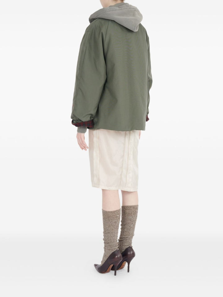 Maison Margiela
Camicia verde oliva, design trapuntato,
