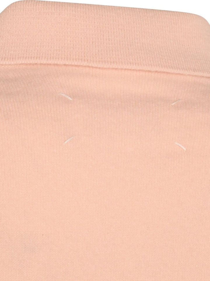 Maison Margiela
Maglione in lana con scollo a V