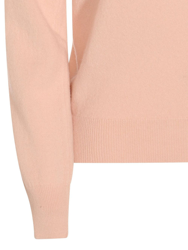 Maison Margiela
Maglione in lana con scollo a V