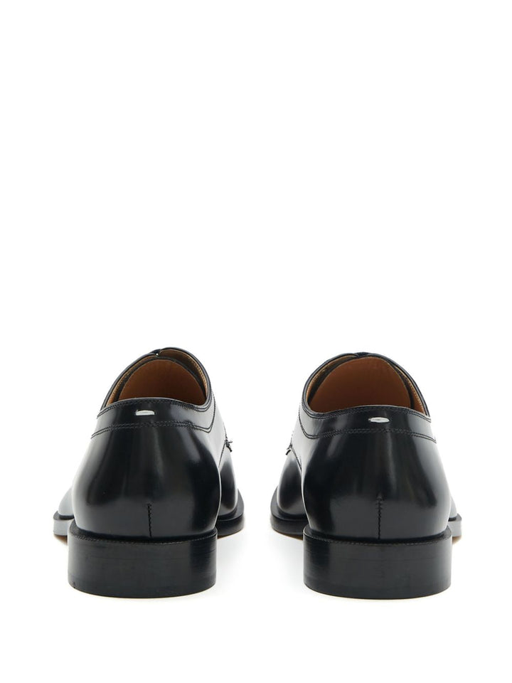 Maison Margiela
Stringate Tabi