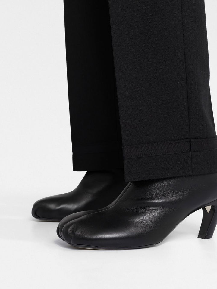 Martin Margiela
Pantaloni plissettati