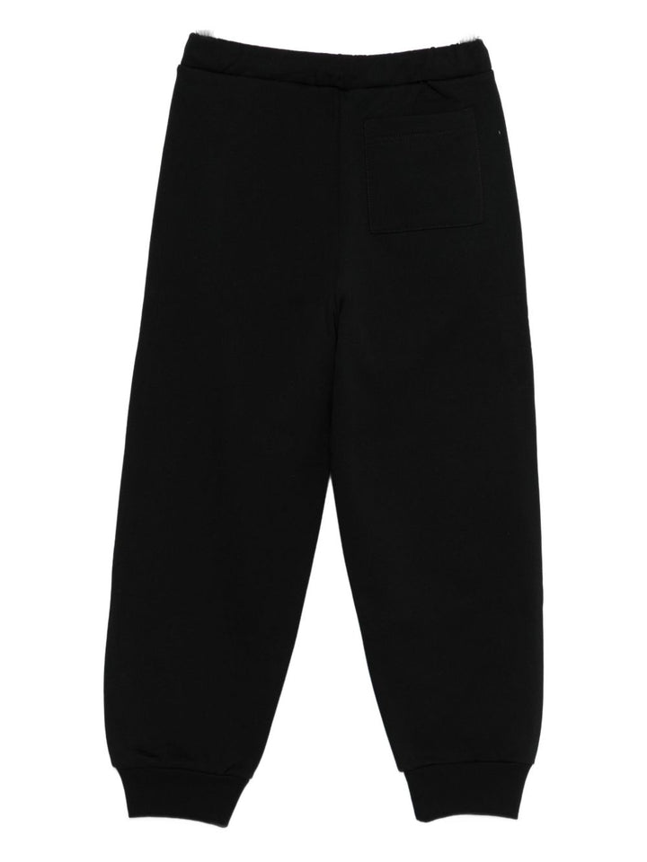 MARNI KIDS
Pantaloni con firma logo nel fondo.