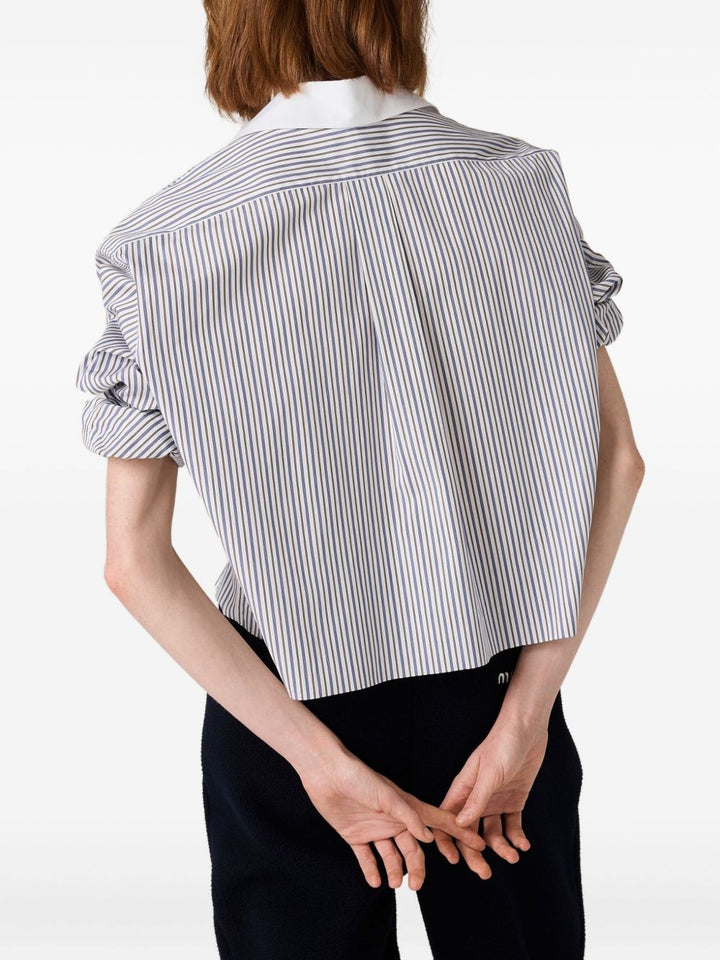 Miu Miu
Camicia a righe con ricamo