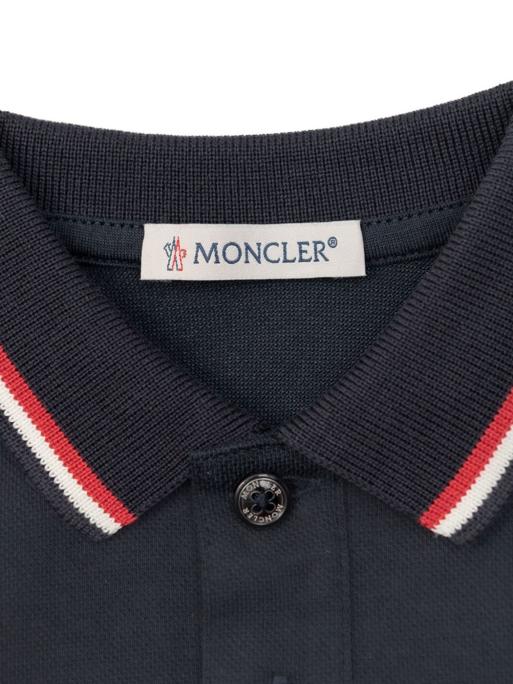 Moncler Enfant
Tutina in cotone piquet con orlo tricolore