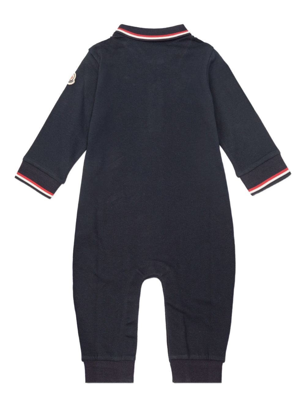 Moncler Enfant
Tutina in cotone piquet con orlo tricolore