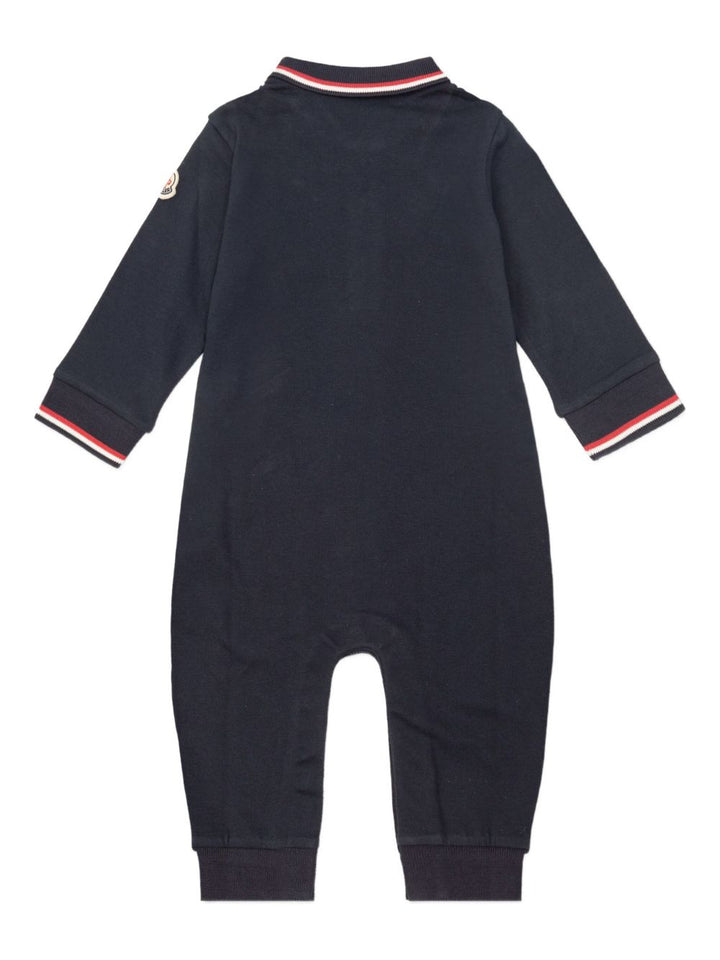 Moncler Enfant
Tutina in cotone piquet con orlo tricolore