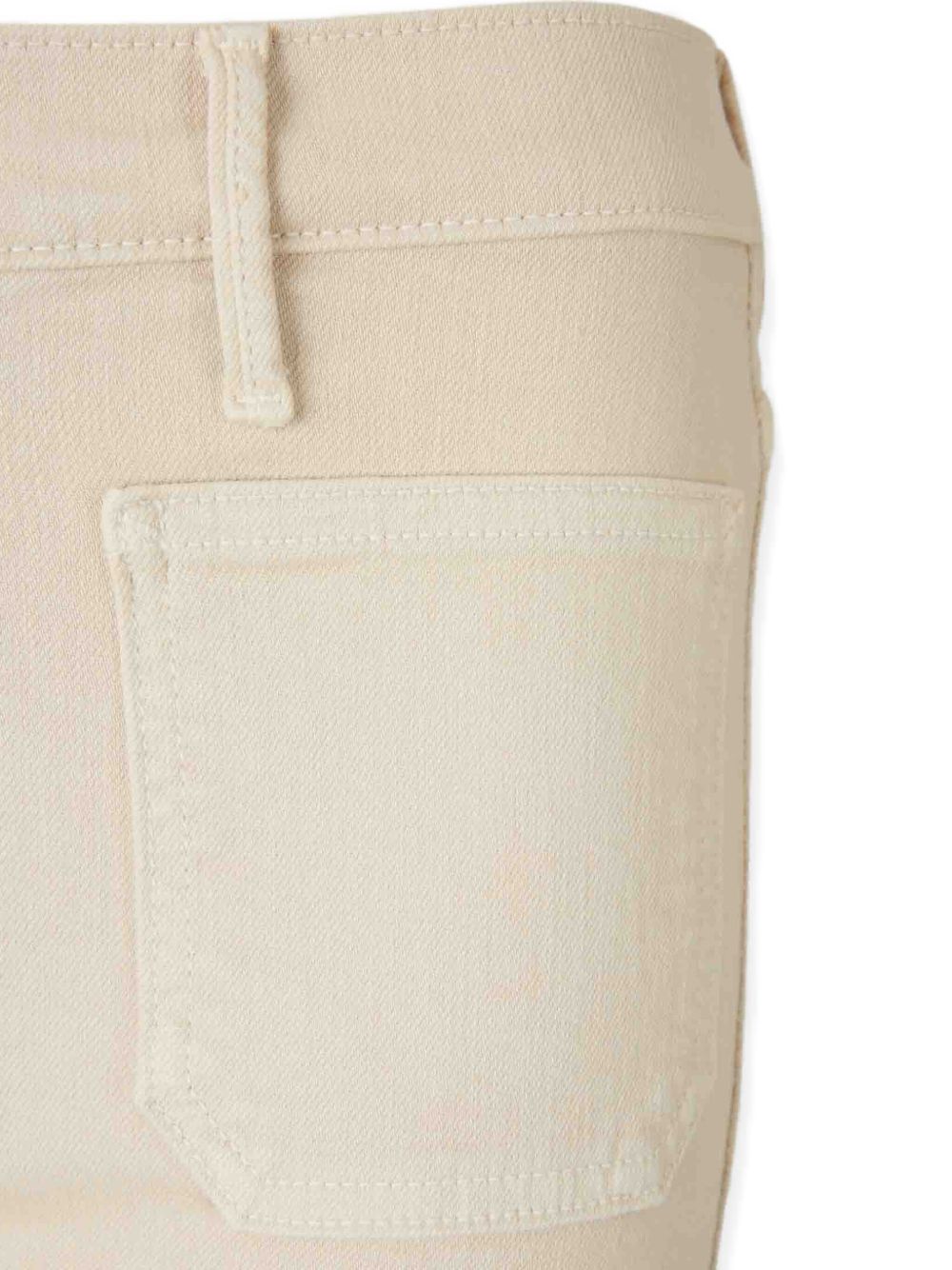 MOTHER
Jeans svasati con applicazione