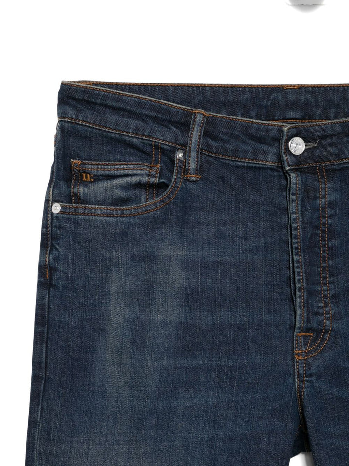 Nine In The Morning
jeans effetto baffuto
