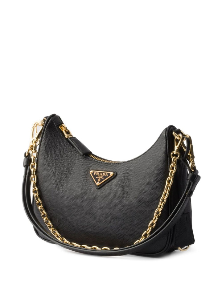 Prada
Borsa 

chiusura superiore con cerniera nera, logo triangolare in smalto, tracolla a catena