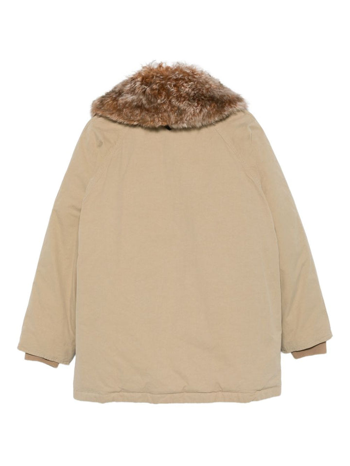 Prada

Giacca in pelliccia sintetica beige