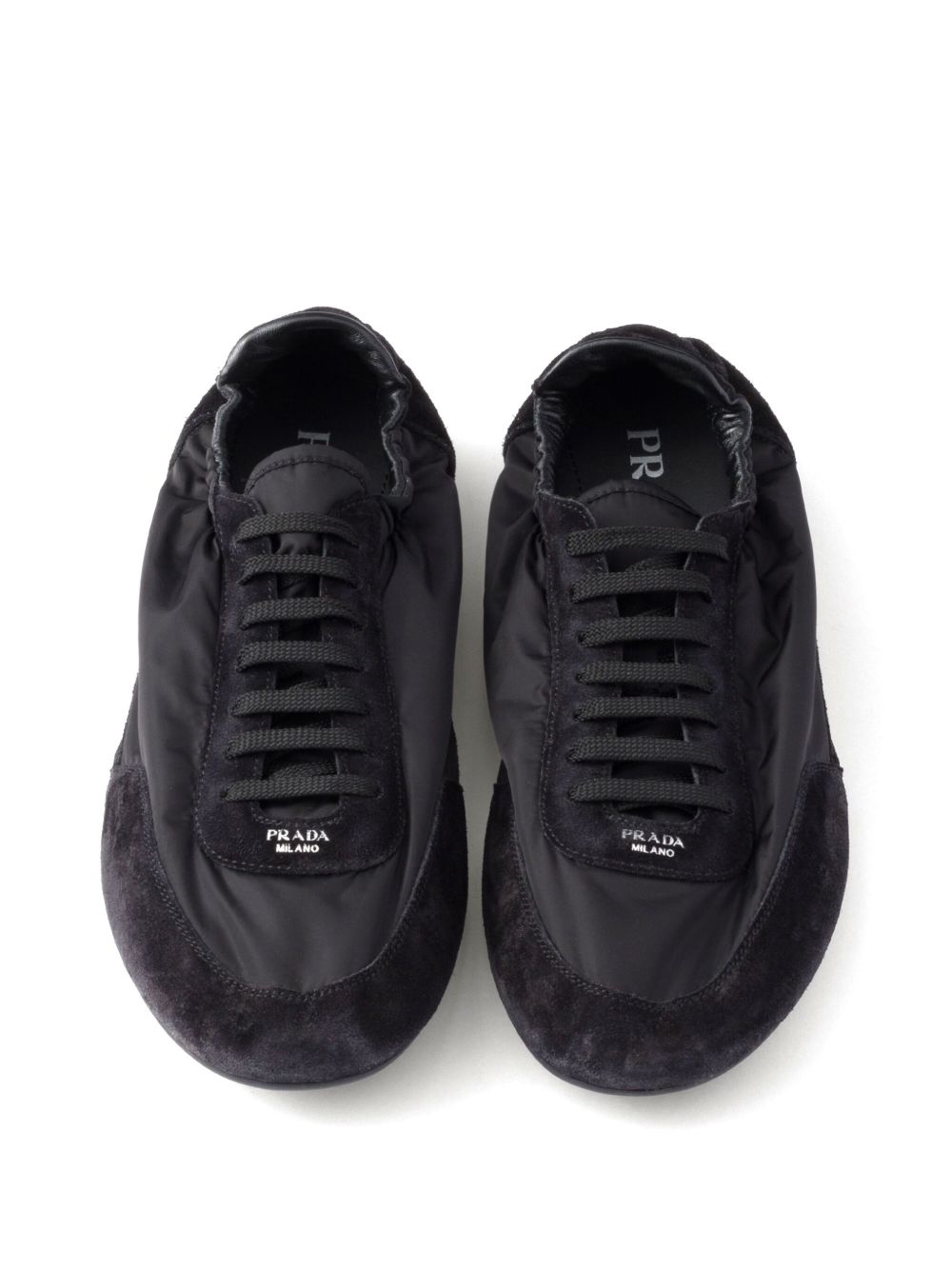 Prada
Sneakers Collapse Re-Nylon in pelle scamosciata