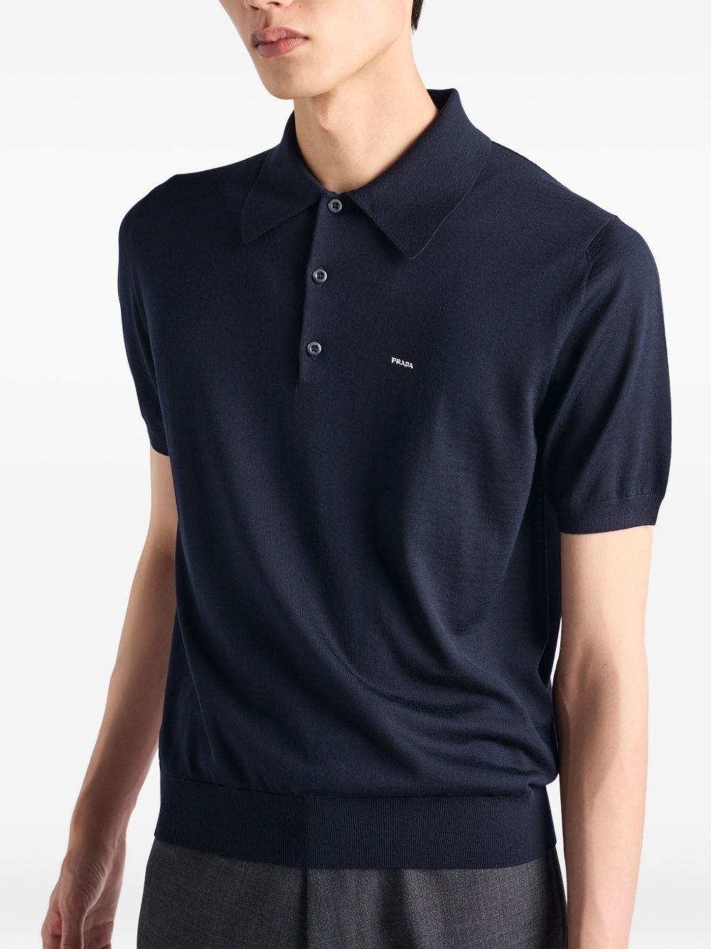 Prada
Polo in lana con logo