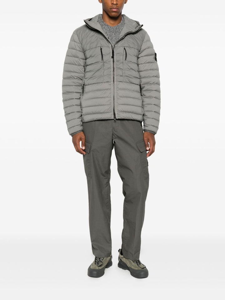 Stone Island
Piumino con cappuccio