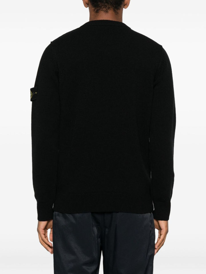 Stone Island
Maglione con scollo a V e badge con logo