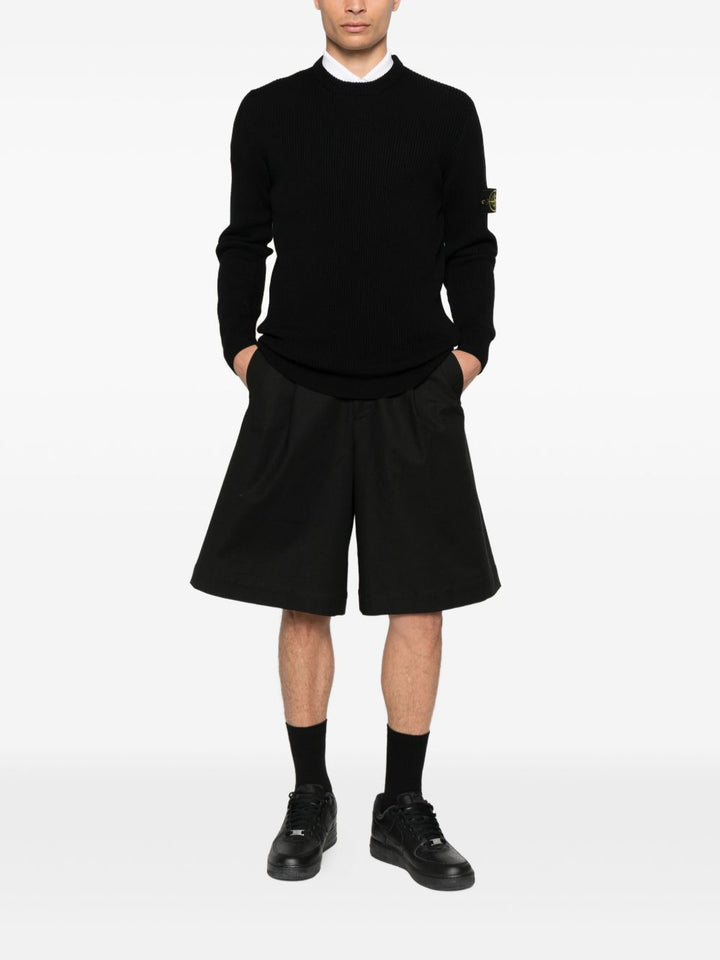Stone Island
Maglione a coste con applicazione