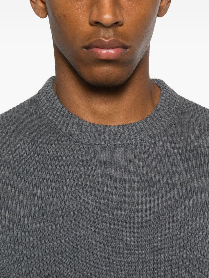 Stone Island
Maglione a coste con applicazione