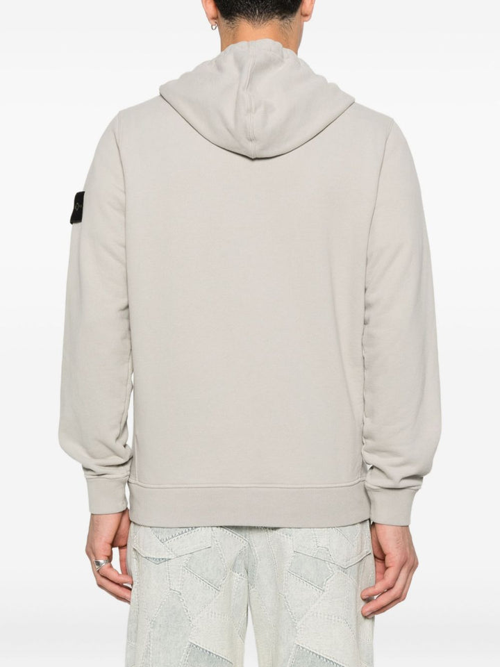 Stone Island
Felpa con cappuccio e zip con logo e stemma
