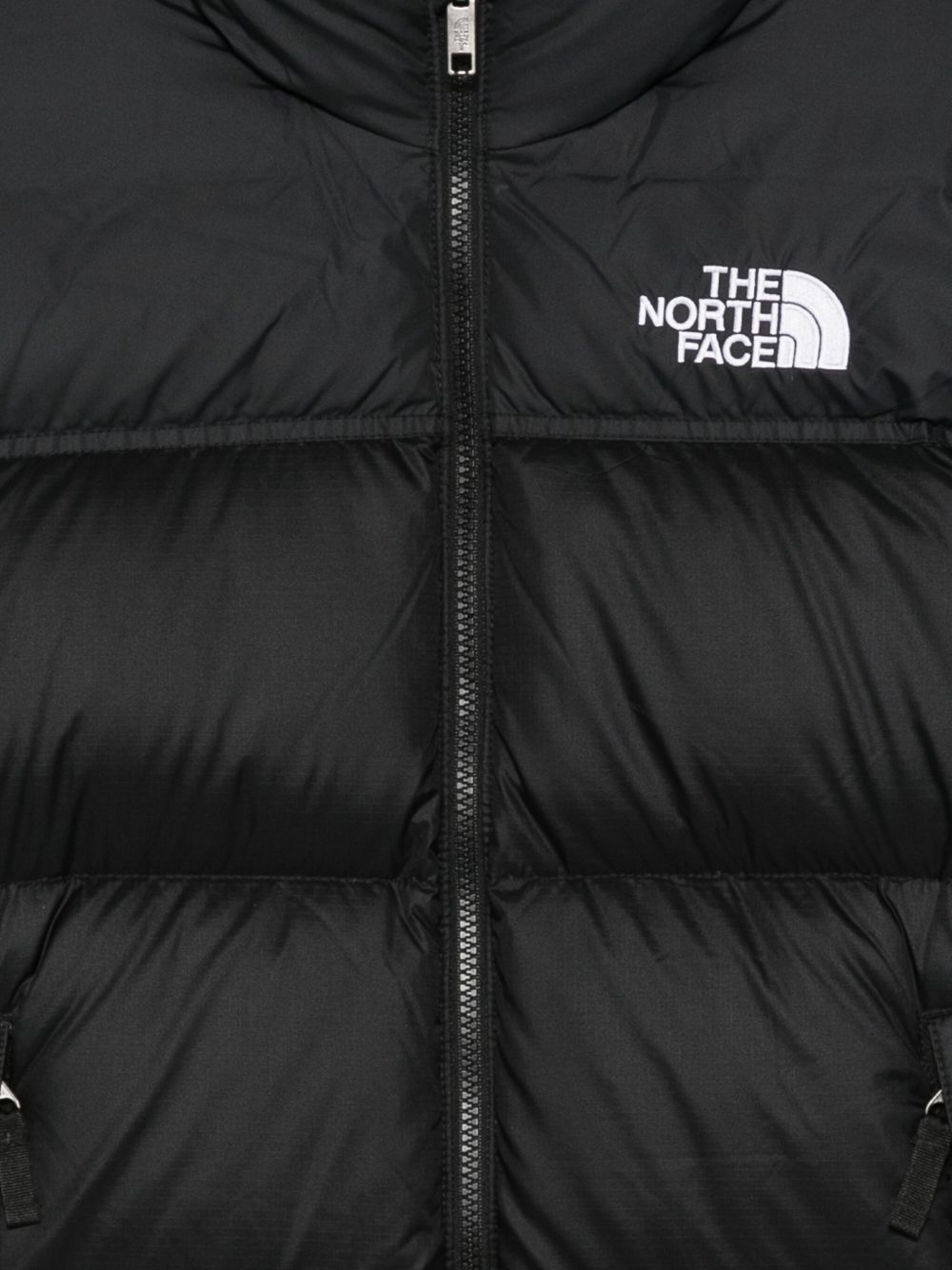 The North Face kids piumono nero con zip