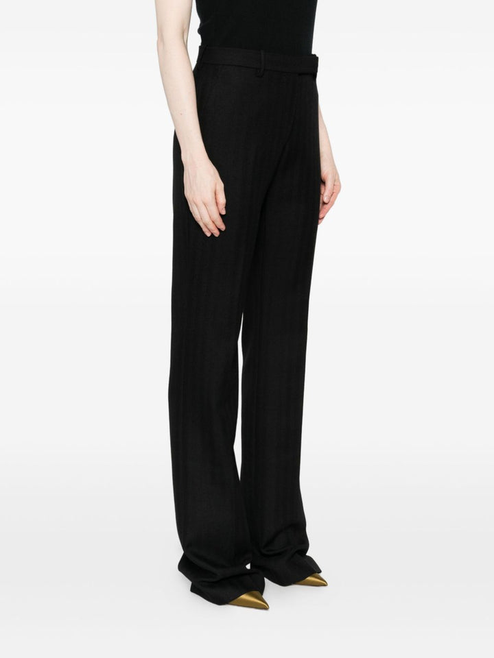 Tom Ford
Pantaloni neri in lana vergine con bottoni