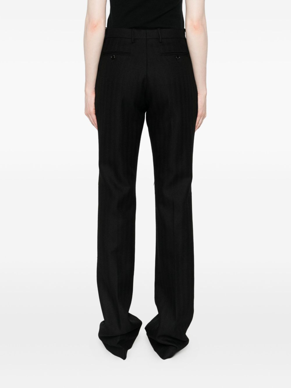 Tom Ford
Pantaloni neri in lana vergine con bottoni