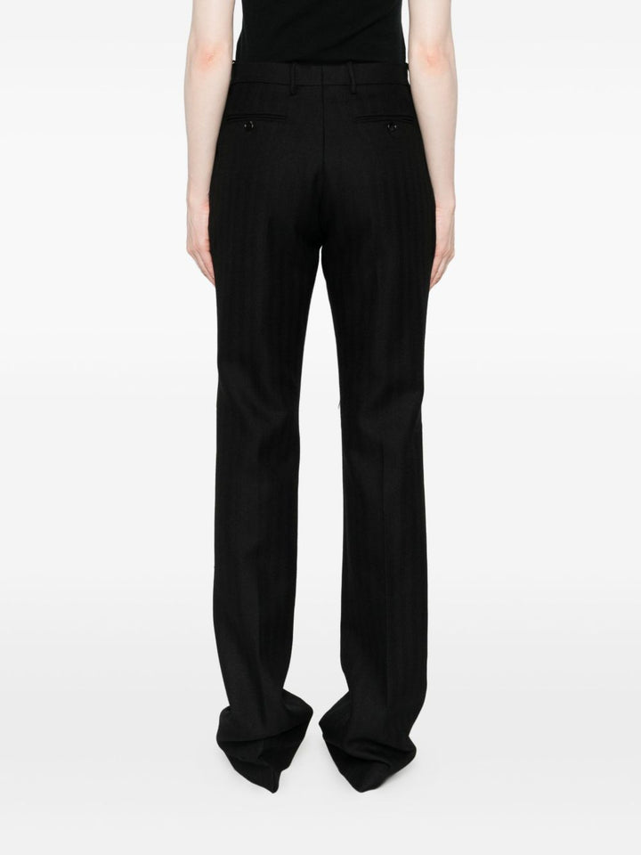 Tom Ford
Pantaloni neri in lana vergine con bottoni