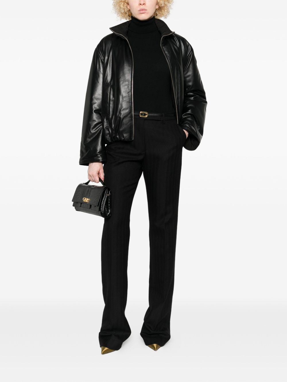 Tom Ford
Pantaloni neri in lana vergine con bottoni