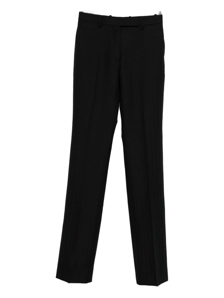 Tom Ford
Pantaloni neri in lana vergine con bottoni