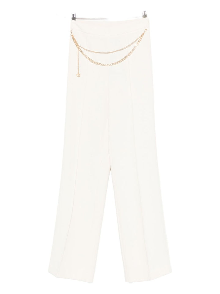TWINSET 
Pantalone bianco con catena in vita.