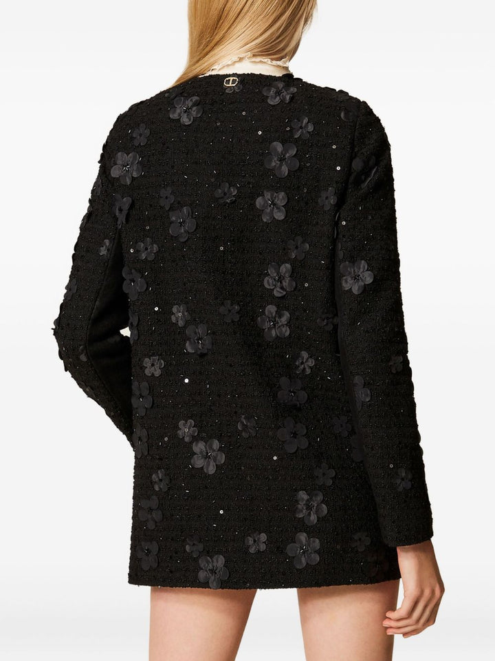 Twinset
Cappotto nero con texture bouclé