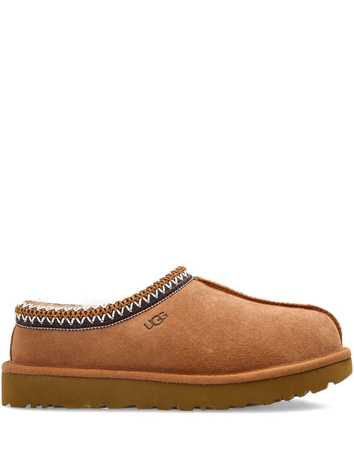 UGG in montone con finiture intrecciate