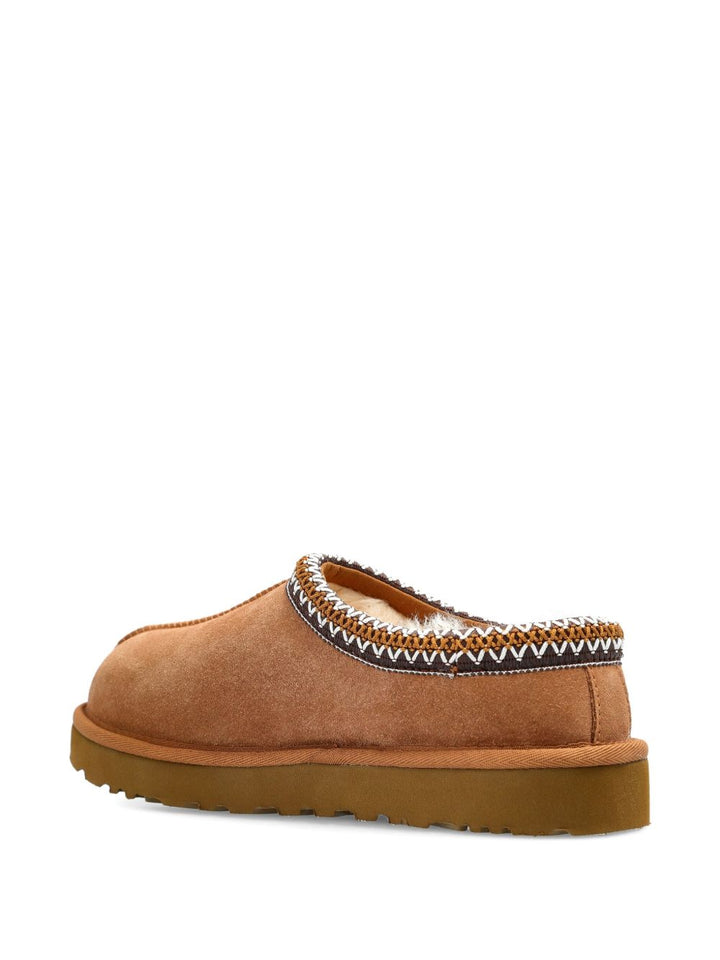 UGG in montone con finiture intrecciate