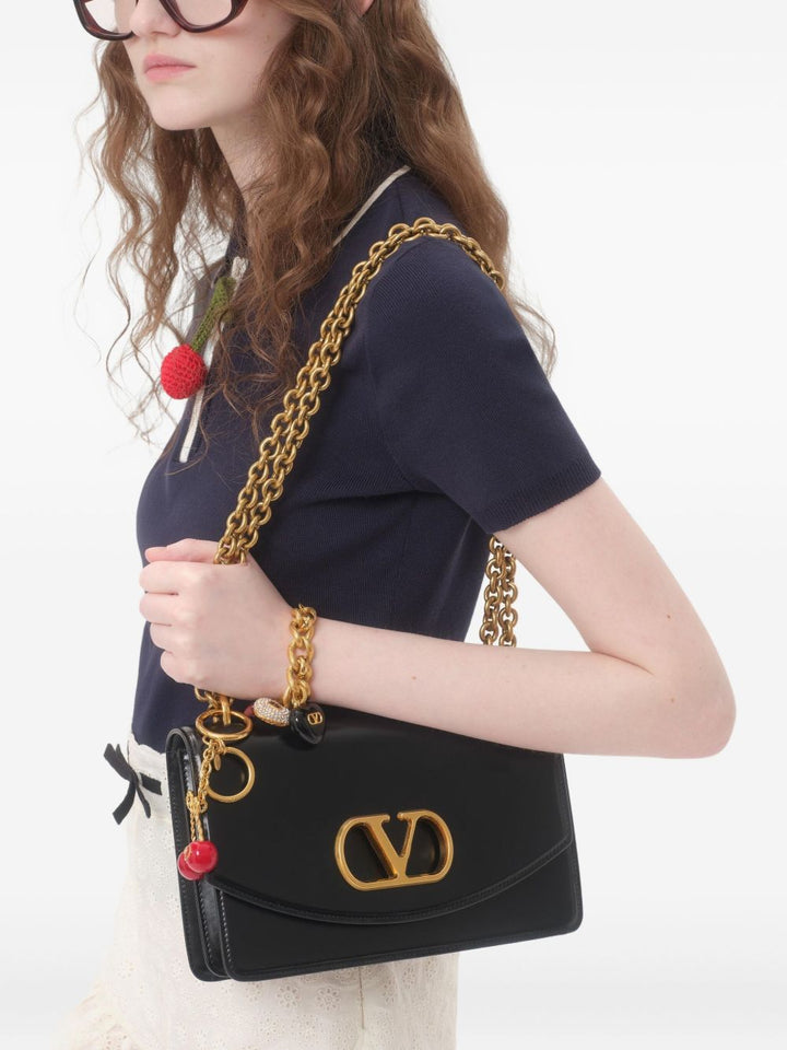 Valentino Garavani
Polo con ciondolo Cherry