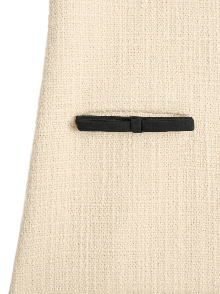 Valentino Garavani
Abito in tweed con fiocco