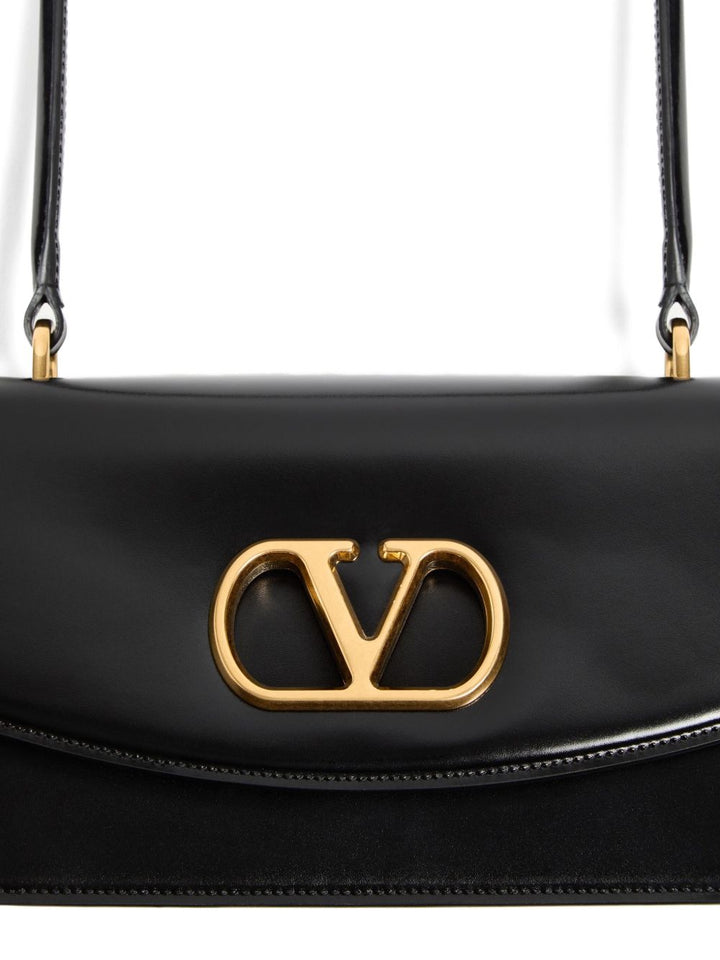 Valentino Garavani
Borsa nera con patta superiore