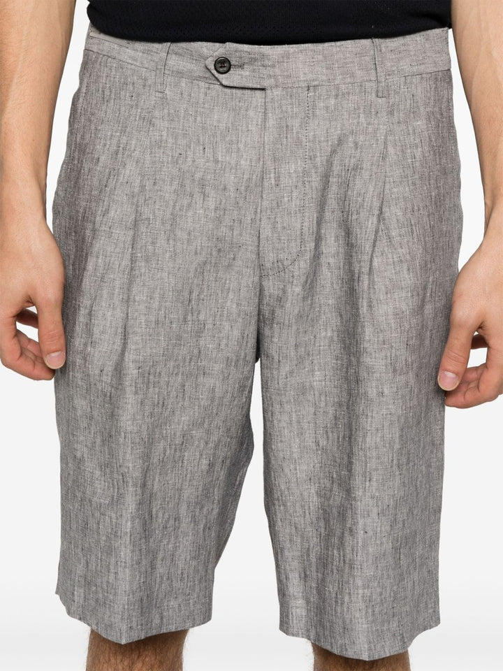 Corneliani
Chino corti con pieghe