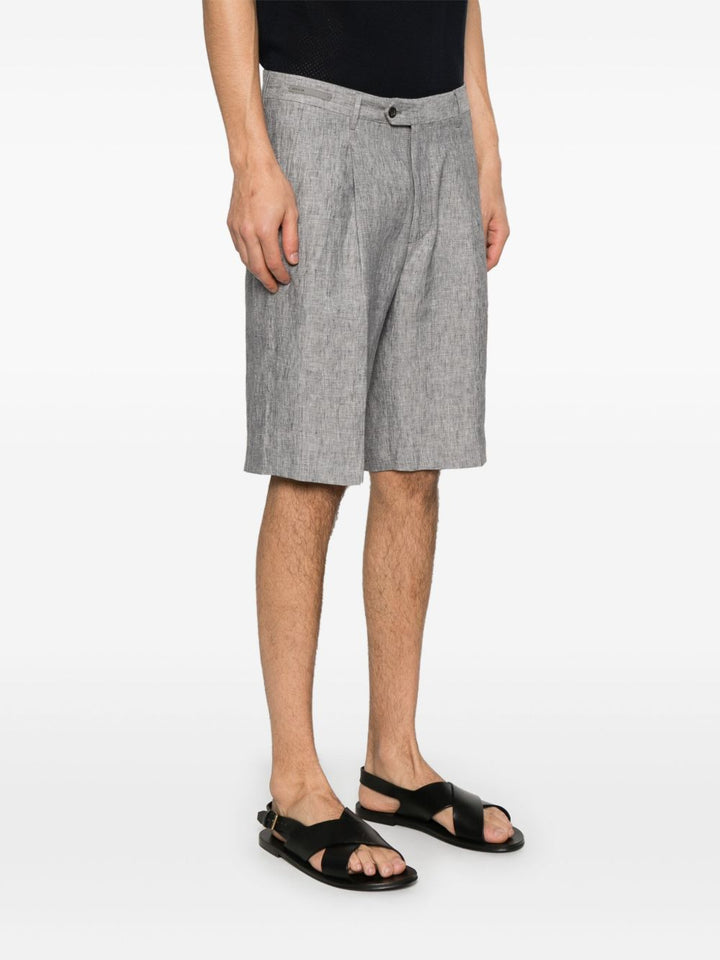 Corneliani
Chino corti con pieghe