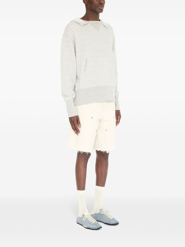 Maison Margiela
Maglione con scollo a V