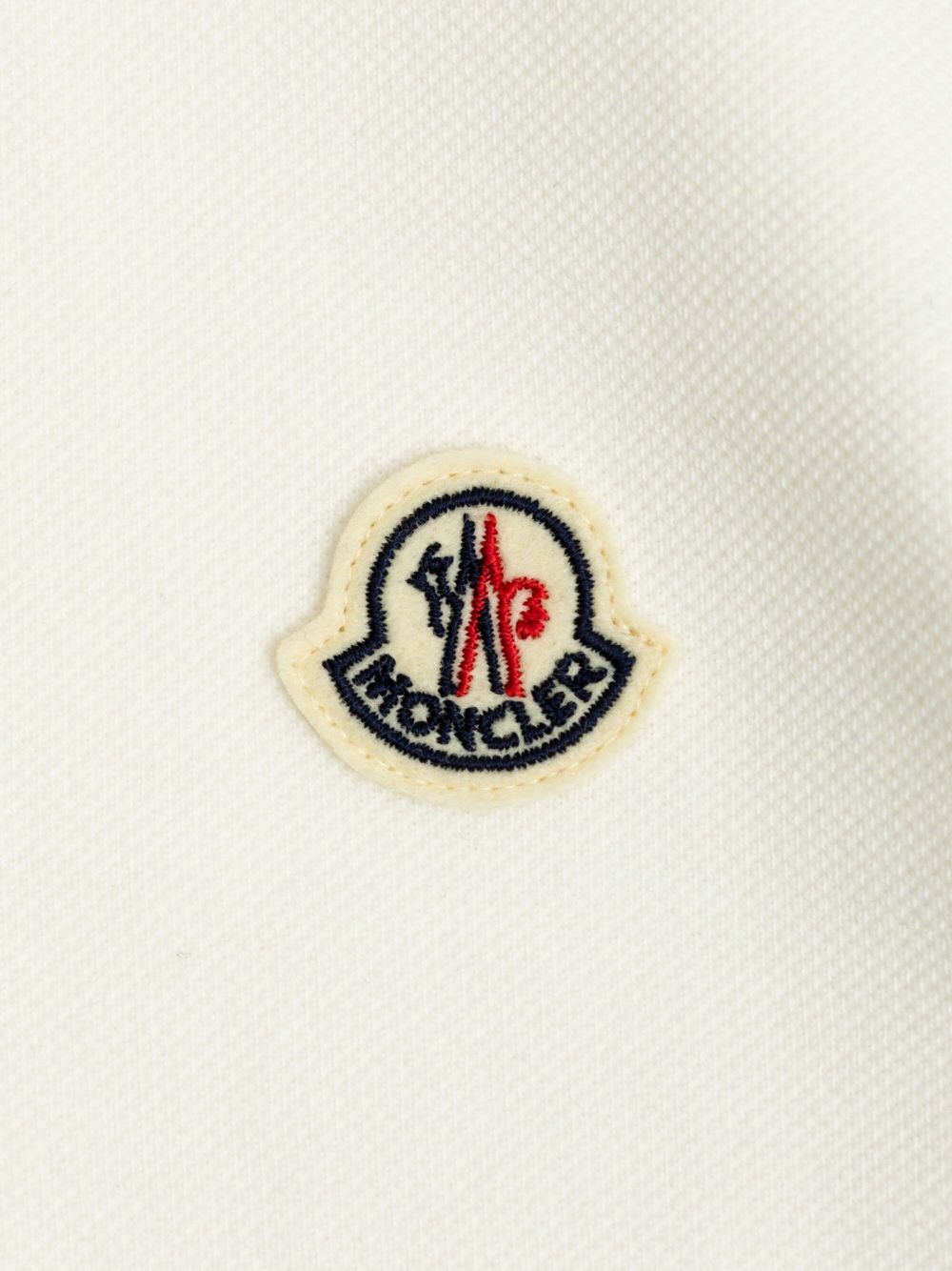 Moncler Enfant
Polo in cotone con ricamo logo