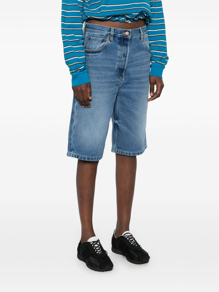Prada
Shorts denim con applicazione