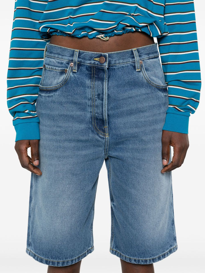 Prada
Shorts denim con applicazione