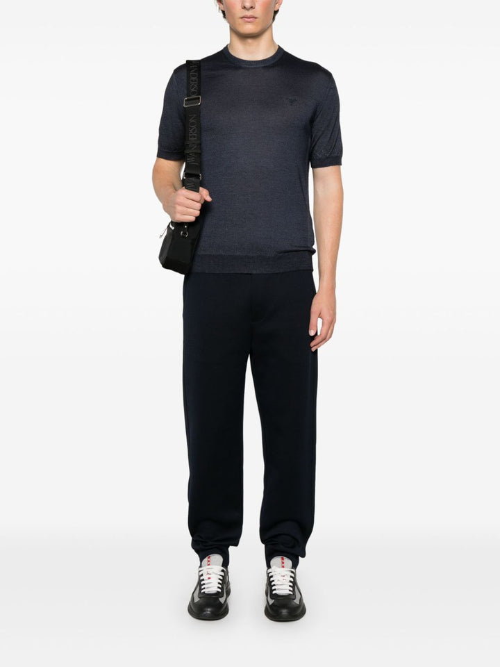 Prada
T-shirt con logo ricamato